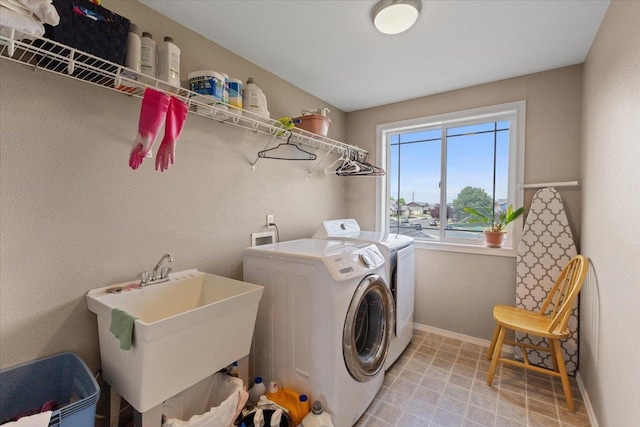 9713 W Sage Ct, Cheney, WA 99004 - laundry area featuring washer and dryer and baseboards