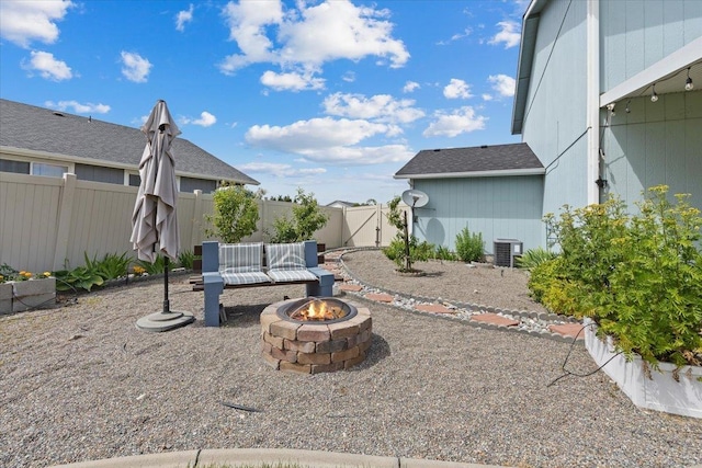 9713 W Sage Ct, Cheney, WA 99004 - fenced yard featuring a fire pit and a gate
