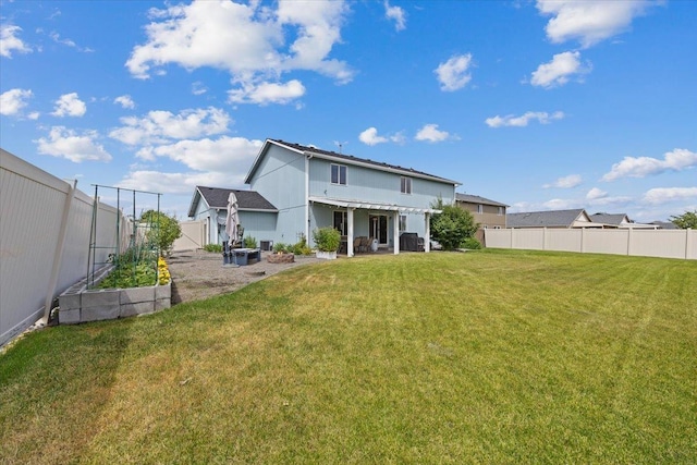 9713 W Sage Ct, Cheney, WA 99004 - back of house with a garden, a fenced backyard, and a patio area