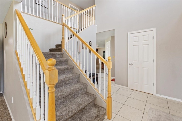 9713 W Sage Ct, Cheney, WA 99004 - stairway with tile patterned flooring and a high ceiling