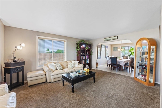 9713 W Sage Ct, Cheney, WA 99004 - carpeted living area with arched walkways and healthy amount of natural light