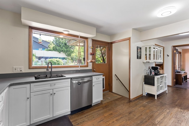 5704 N Sutherlin St, Spokane, WA 99205 - kitchen with stainless steel dishwasher, dark wood-type flooring, white cabinets, and plenty of natural light