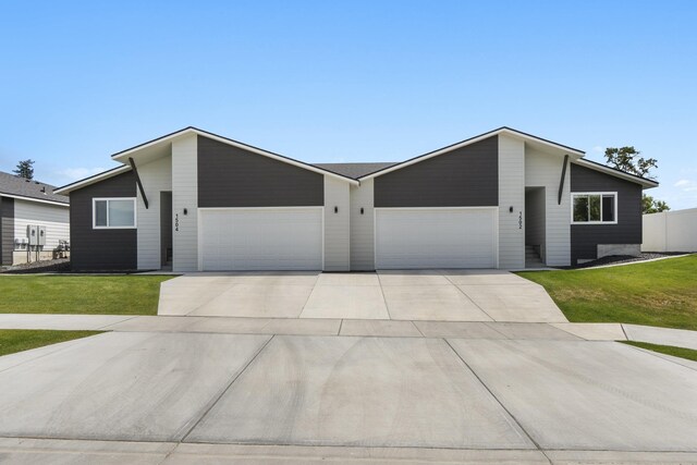 1502 N Bell St, Spokane Valley, WA 99016 - mid-century inspired home with an attached garage, concrete driveway, and a front lawn
