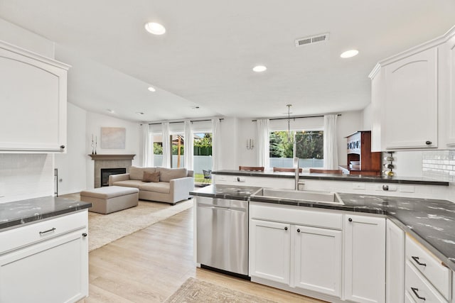 2808 E 62nd Ln, Spokane, WA 99223 - kitchen featuring dishwasher, recessed lighting, tasteful backsplash, white cabinetry, and open floor plan