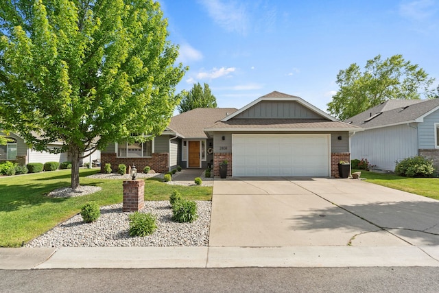 2808 E 62nd Ln, Spokane, WA 99223 - view of front facade with brick siding, an attached garage, concrete driveway, a front lawn, and board and batten siding