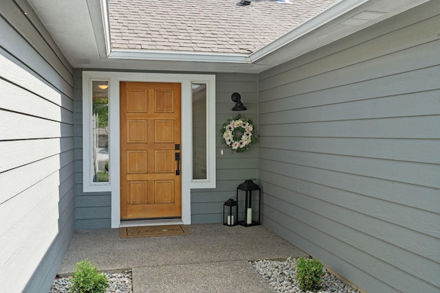 2808 E 62nd Ln, Spokane, WA 99223 - doorway to property with a shingled roof