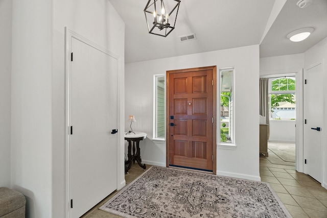 2808 E 62nd Ln, Spokane, WA 99223 - foyer entrance with a chandelier, light tile patterned floors, and lofted ceiling