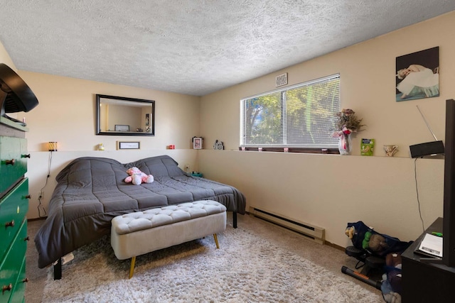 1526-1528 E Rowan Ave, Spokane, WA 99207 - bedroom with carpet, a baseboard heating unit, and a textured ceiling