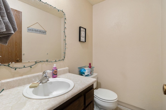 1526-1528 E Rowan Ave, Spokane, WA 99207 - half bath featuring vanity and a textured wall