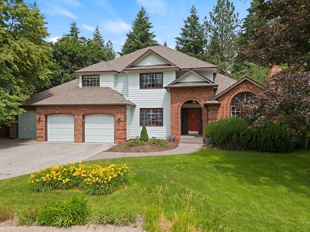 13419 N Whitehouse Ct, Spokane, WA 99208 - traditional-style home with an attached garage, brick siding, concrete driveway, and a front yard