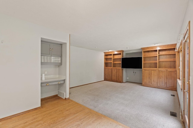 13419 N Whitehouse Ct, Spokane, WA 99208 - unfurnished living room featuring light wood-style flooring and built in desk