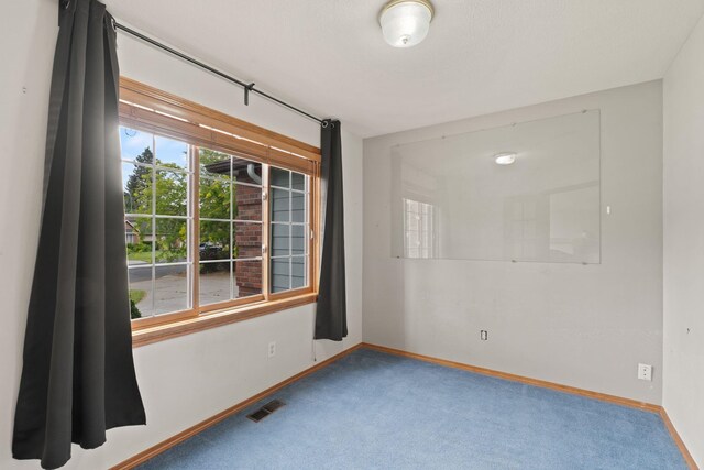 13419 N Whitehouse Ct, Spokane, WA 99208 - carpeted spare room featuring baseboards
