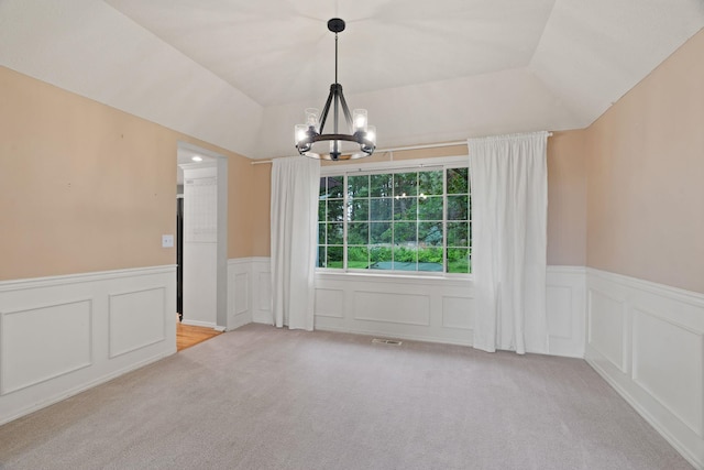 13419 N Whitehouse Ct, Spokane, WA 99208 - unfurnished dining area featuring carpet, a chandelier, a wainscoted wall, and a decorative wall