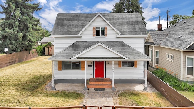 2403 W Mallon Ave, Spokane, WA 99201 - bungalow-style house with a fenced backyard, roof with shingles, and a porch