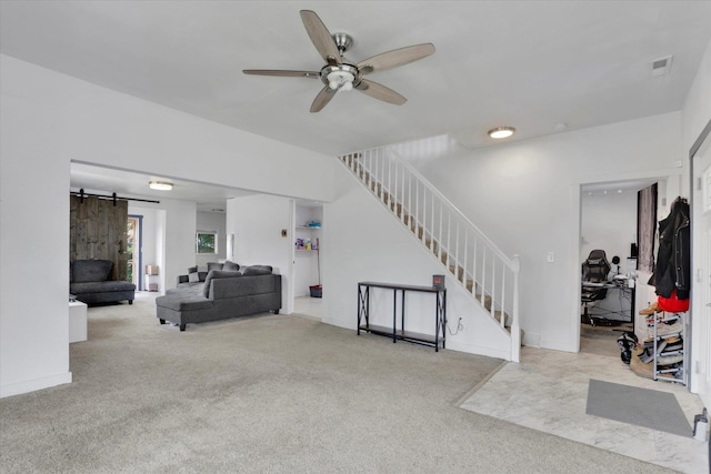 2403 W Mallon Ave, Spokane, WA 99201 - carpeted living area with stairs, a ceiling fan, and a barn door