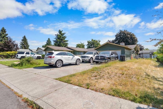 11816-11818 N Wall St, Spokane, WA 99218 - view of yard with concrete driveway and an attached garage