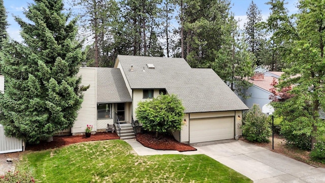 4319 S Myrtle St, Spokane, WA 99223 - view of front of property with a shingled roof, concrete driveway, a front lawn, and an attached garage