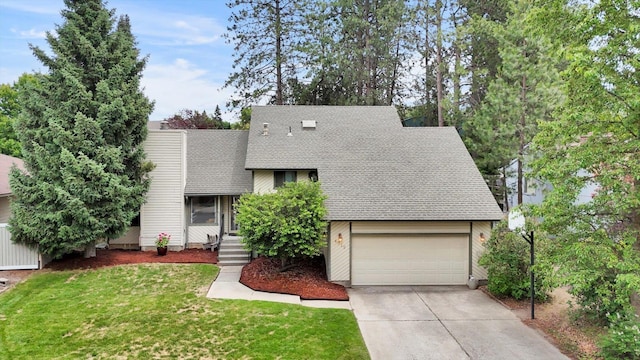 4319 S Myrtle St, Spokane, WA 99223 - a-frame style home with a garage, driveway, a front yard, and roof with shingles