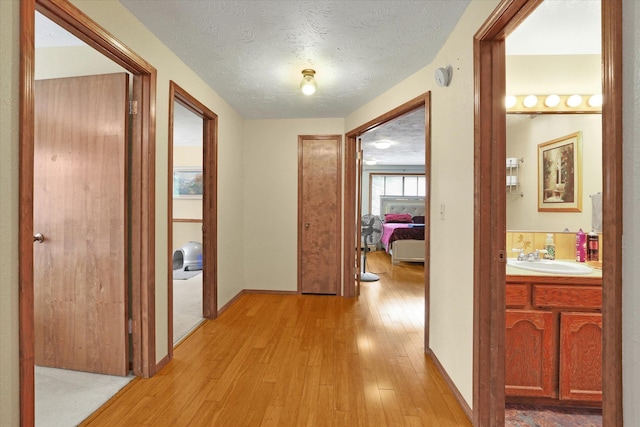 4319 S Myrtle St, Spokane, WA 99223 - hallway with light wood finished floors and a textured ceiling