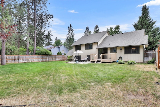 4319 S Myrtle St, Spokane, WA 99223 - rear view of property featuring a fenced backyard, a wooden deck, a patio, and roof with shingles