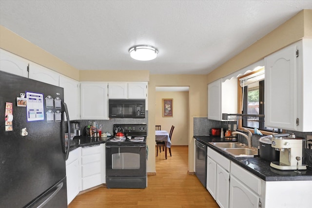 4319 S Myrtle St, Spokane, WA 99223 - kitchen with black appliances, dark countertops, tasteful backsplash, white cabinets, and a textured ceiling