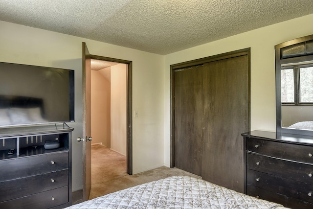 1026 W Bellwood Dr, Spokane, WA 99218 - bedroom with a closet, carpet floors, and a textured ceiling