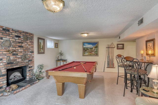 1026 W Bellwood Dr, Spokane, WA 99218 - recreation room with carpet flooring, a textured ceiling, billiards, and a brick fireplace