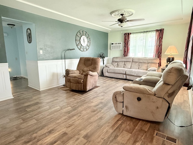 1710 E Crown Ave, Spokane, WA 99207 - living area with ceiling fan, wood finished floors, wainscoting, and a wall mounted AC