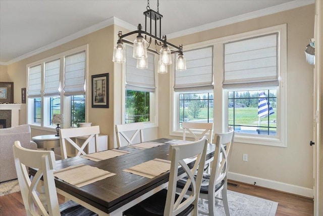 1716 W Country Hunt Ln, Spokane, WA 99224 - dining space with ornamental molding, healthy amount of natural light, wood finished floors, and a fireplace