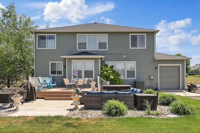1716 W Country Hunt Ln, Spokane, WA 99224 - rear view of house with an outdoor living space, a wooden deck, a garage, and driveway