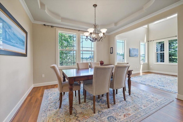 1716 W Country Hunt Ln, Spokane, WA 99224 - dining area with a chandelier, a tray ceiling, and wood finished floors