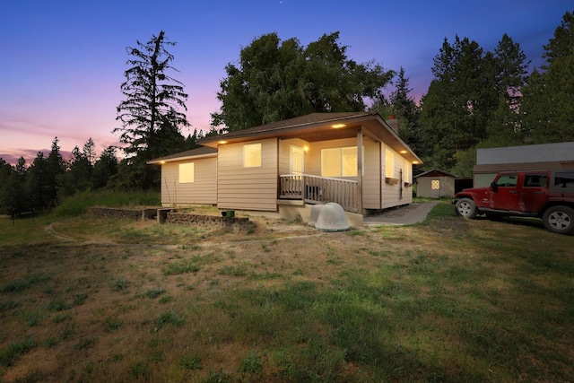 42503 N Regal Rd, Elk, WA 99009 - view of front of property featuring a porch, a lawn, and a chimney