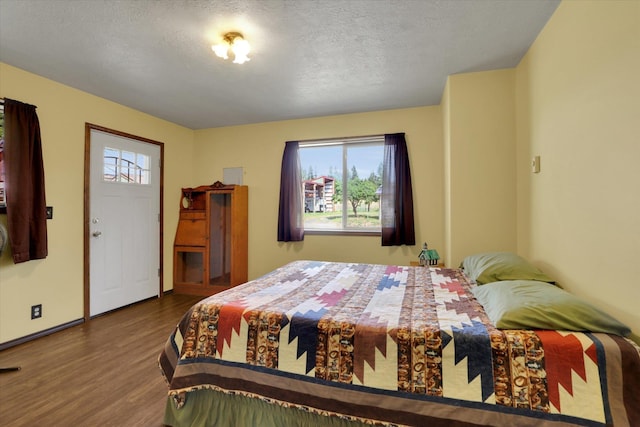 42503 N Regal Rd, Elk, WA 99009 - bedroom featuring wood finished floors and a textured ceiling