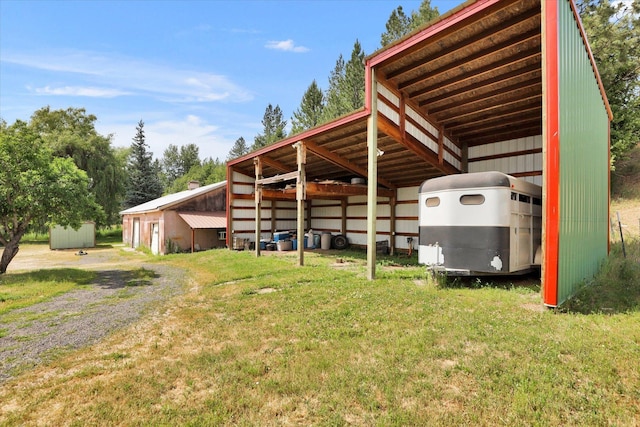 42503 N Regal Rd, Elk, WA 99009 - view of parking featuring an outbuilding, a detached carport, and driveway