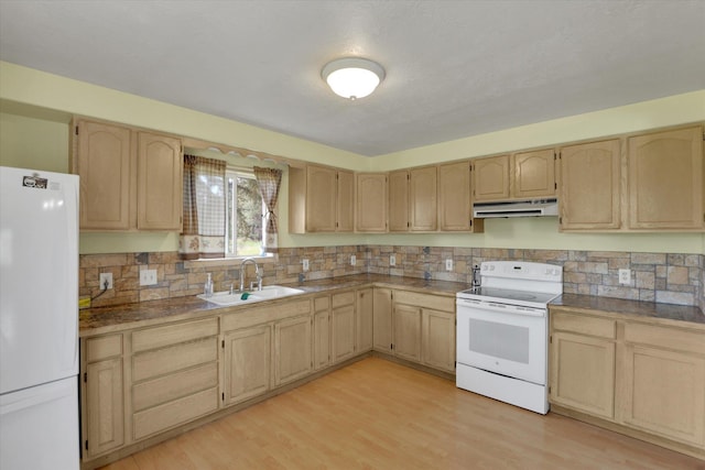 42503 N Regal Rd, Elk, WA 99009 - kitchen with white appliances, under cabinet range hood, light brown cabinets, and decorative backsplash