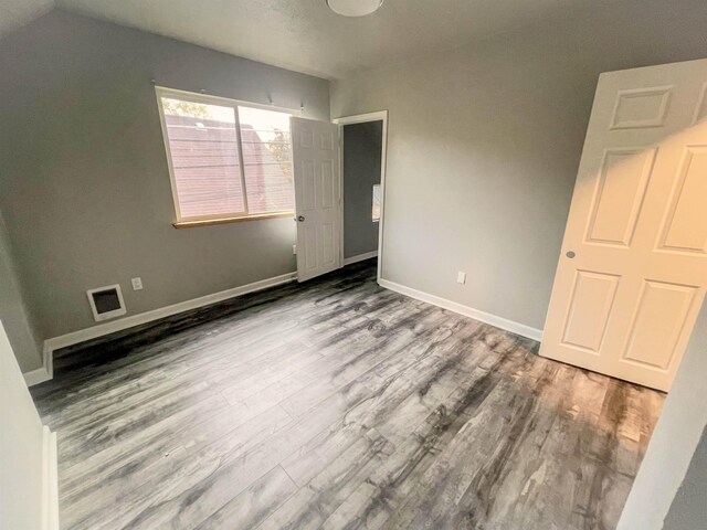 1616 N Cedar Ave, Spokane, WA 99205 - unfurnished bedroom featuring wood finished floors and baseboards
