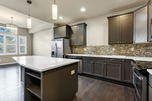 2121 W Bridge Ave Unit 2121, Spokane, WA 99201 - kitchen featuring stainless steel appliances, dark wood-style floors, open shelves, backsplash, and light countertops