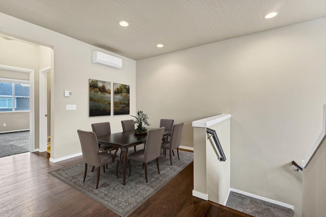 2121 W Bridge Ave Unit 2121, Spokane, WA 99201 - dining area featuring a wall unit AC, recessed lighting, and wood finished floors