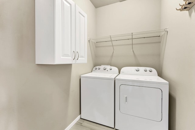 2121 W Bridge Ave Unit 2121, Spokane, WA 99201 - laundry room with washer and dryer and cabinet space