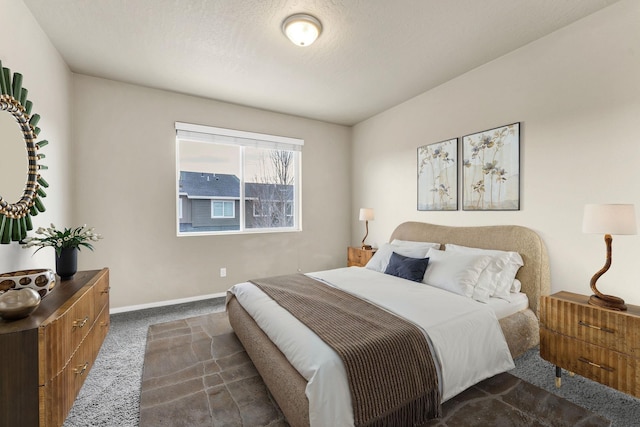 2121 W Bridge Ave Unit 2121, Spokane, WA 99201 - bedroom with dark carpet and baseboards