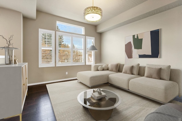 2121 W Bridge Ave Unit 2121, Spokane, WA 99201 - living room featuring dark wood-style floors and baseboards