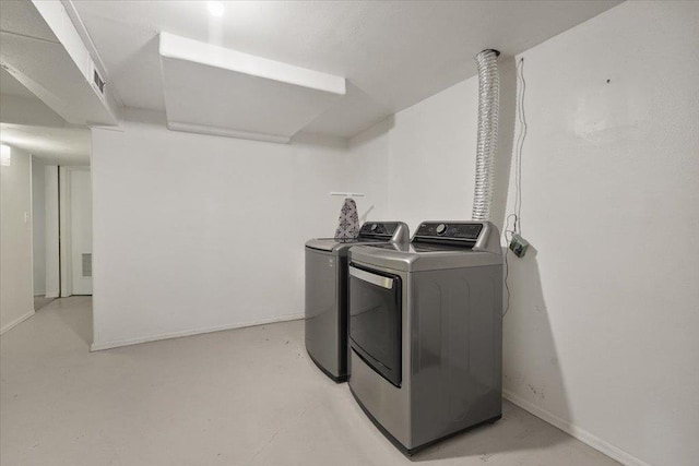 5318 N Walnut St, Spokane, WA 99205 - laundry room with washing machine and dryer and baseboards