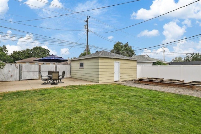 5318 N Walnut St, Spokane, WA 99205 - fenced backyard with a patio and an outbuilding
