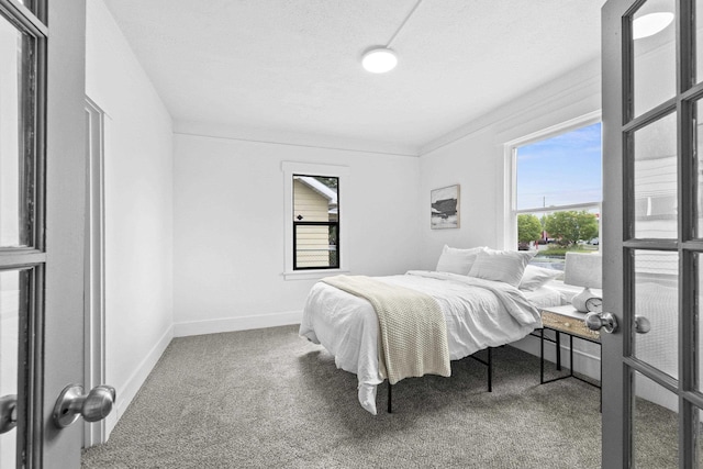 411 S Ferrall St, Spokane, WA 99202 - carpeted bedroom with baseboards and a textured ceiling