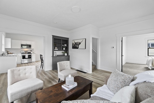 411 S Ferrall St, Spokane, WA 99202 - living area with stairway and light wood-style flooring