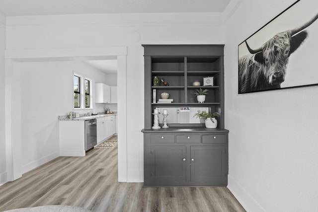 411 S Ferrall St, Spokane, WA 99202 - bar with light wood-style floors, dishwasher, and built in shelves