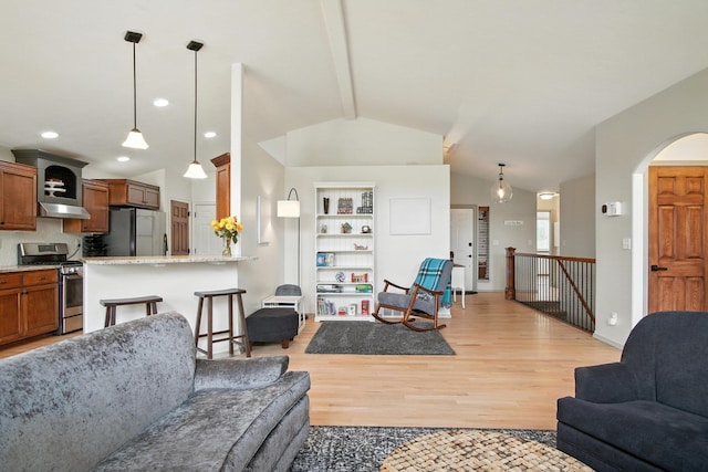 116 W Bristol Ave, Spokane, WA 99224 - living area with light wood-style floors and arched walkways