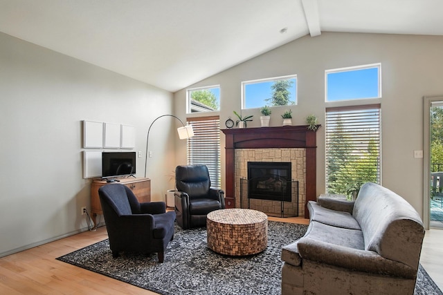 116 W Bristol Ave, Spokane, WA 99224 - living room with wood finished floors, a glass covered fireplace, beamed ceiling, and high vaulted ceiling
