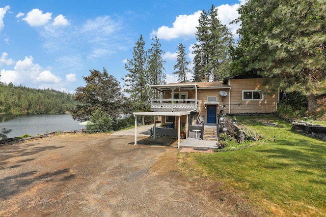 6519I Myrtle Dr, Nine Mile Falls, WA 99026 - view of front of property with a water view, a front lawn, dirt driveway, a patio, and stairway