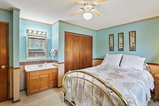 6519I Myrtle Dr, Nine Mile Falls, WA 99026 - bedroom featuring a closet, light carpet, a ceiling fan, and crown molding